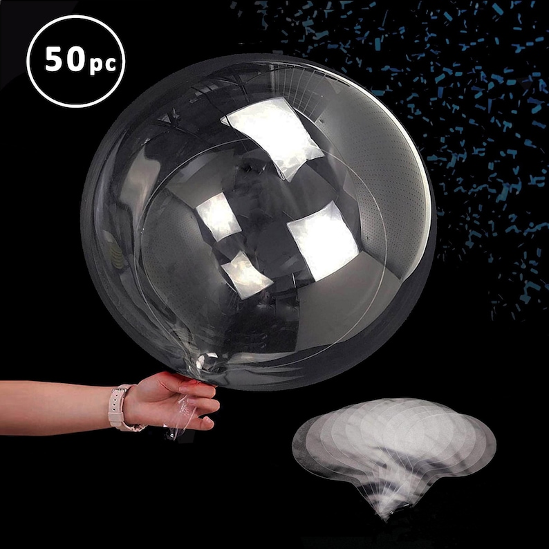 May include: A set of 50 clear plastic balloons with a hand holding one of the balloons. The balloons are inflated and have a shiny, reflective surface. The balloons are surrounded by blue confetti.