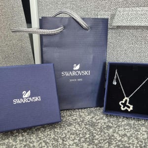 Genuine pristine Swarovski Retired "Gamma" Butterfly , Star Necklace Full Gift Set with complimentary Swarovski gift Bag