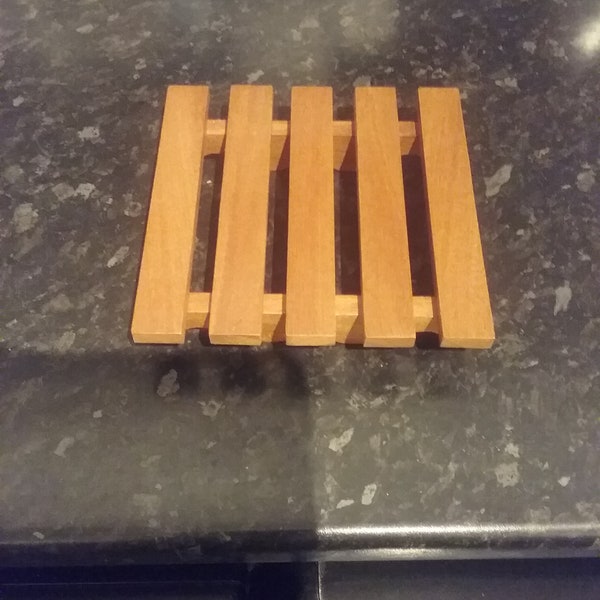 Hardwood trivets , for standing  indoor pots on or use in the kitchen.