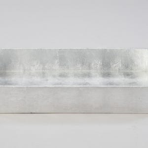 May include: A silver rectangular tray with a slightly textured surface. The tray is made of wood and has a raised edge.