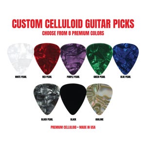 May include: Custom celluloid guitar picks in eight colors: white pearl, red pearl, purple pearl, green pearl, blue pearl, black pearl, solid black, and abalone. The text reads: CUSTOM CELLULOID GUITAR PICKS, CHOOSE FROM 8 PREMIUM COLORS, PREMIUM CELLULOID • MADE IN USA.
