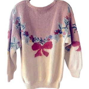 Vintage 1980s Hand-Knit Cream and Pink Crew Neck Sweater with Festive Bow Design.