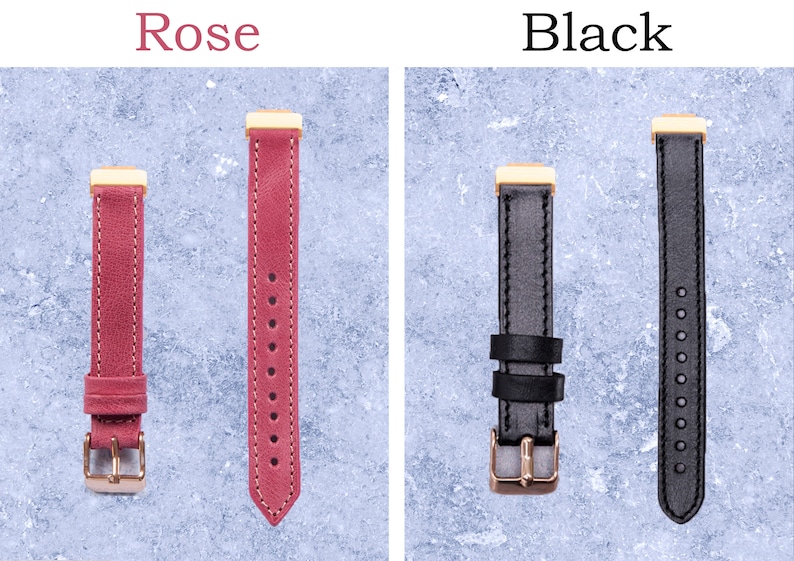 May include: Two watch straps, one rose-colored and one black, are displayed. The rose strap has a gold-colored buckle and hardware, with the word "Rose" above it. The black strap has a gold-colored buckle and hardware, with the word "Black" above it.