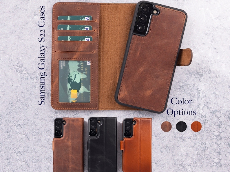 May include: A brown leather wallet case for a Samsung Galaxy S22 phone. The case features a built-in card holder and a flap that closes with a magnetic snap. The case is available in brown, black, and tan.