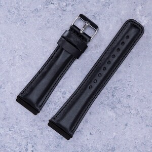 May include: Two black leather watch straps with silver buckles. One strap has a smooth finish, while the other has a row of small holes.