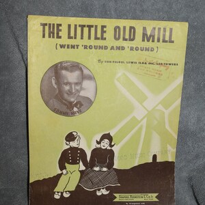 May include: A vintage sheet music cover for the song "The Little Old Mill (Went 'Round and 'Round)" by Don Pelosi, Lewis Ilda and Leo Towers. The cover features a black and white photo of Sammy Kove, a windmill, and two children in traditional Dutch clothing.