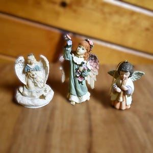 Lot Of 3 Vintage Angels - 2 Resin Angel Figurines, 1 Porcelain/Ceramic Angel Playing A Horn Ornament/Bell - All Are Unbranded