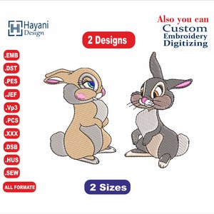 May include: Two embroidered designs of bunnies, one brown and one grey, with pink noses and blue eyes. The text "2 Designs" and "2 Sizes" is also included in the image.