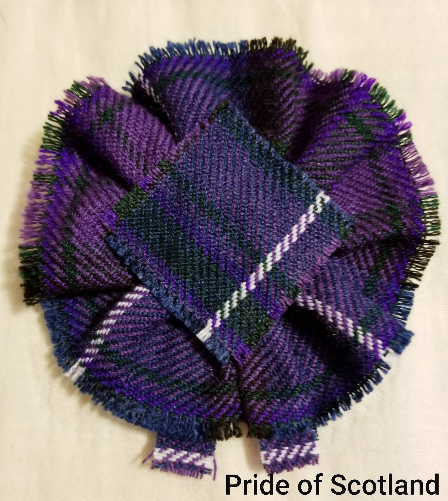 Pride of Scotland Tartan as Scottish Blossom, Tartan Rosette to display brooch, pin or family crest badge.