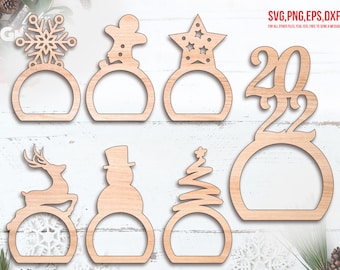 May include: Wooden Christmas decorations in various shapes, including a snowflake, gingerbread man, star, the number 2022, a reindeer, a snowman, and a Christmas tree. The text "SVG, PNG, EPS, DXF" is visible.