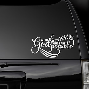 May include: White vinyl decal with the text "With God All Things Are Possible" in a decorative script font. The decal features stylized waves and a leafy flourish.
