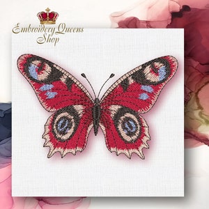 May include: Embroidered butterfly design with red, black, and white details. The butterfly has a detailed wing pattern and is set against a white background.