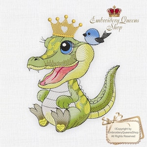 May include: A green and yellow alligator wearing a gold crown with a heart on top. The alligator is sitting with its mouth open and has a blue bird perched on its head. The text "Embroidery Queens Shop" is in the upper right corner of the image.