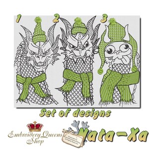 May include: Set of three embroidery designs featuring cartoon dragons wearing winter hats and scarves. The designs are numbered 1, 2, and 3. The text "Set of designs" and "Mata-xa" are also included in the image.