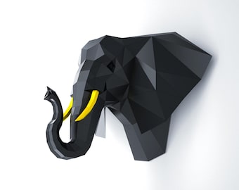 May include: A geometric, black elephant head wall decor with yellow tusks. The elephant head is made of multiple triangular shapes, creating a modern, low-poly design. The trunk is curled, and the piece is mounted on a white wall.