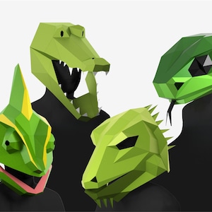 May include: Four geometric animal masks: a green alligator, a green chameleon, a green lizard, and a green snake. The masks are made of folded paper or cardboard, with sharp angles and a polygonal design. The masks are worn by people wearing black tops.