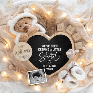 May include: A heartwarming announcement featuring a teddy bear in a hooded outfit, a heart-shaped chalkboard with the text "We've been keeping a little secret", and baby booties. The announcement includes a sonogram image and wooden blocks spelling "BABY".
