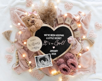 May include: A baby announcement with a pink blanket, teddy bear, and heart-shaped chalkboard. The chalkboard reads "We've been keeping a little secret, It's a Girl!" with the name "Williams" and the date "January 2025". Includes baby booties and ultrasound image.