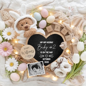 May include: A baby announcement scene featuring a teddy bear in a bunny outfit, flowers, eggs, and wooden blocks spelling "BABY." A heart-shaped chalkboard announces "Baby #2 is on the way" for October 2026. Includes a sonogram image.