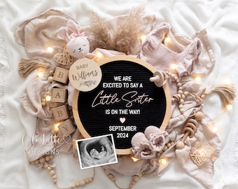 May include: A wooden letter board with the text "We are excited to say a Little Sister is on the way! September 2024". The board is surrounded by a variety of baby-themed items, including a stuffed bunny, wooden blocks, a pair of booties, and a sonogram image.