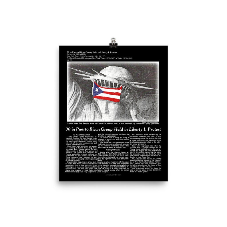 May include: A black and white photo of the Statue of Liberty with a Puerto Rican flag covering her eyes. The photo is from a newspaper article titled "30 in Puerto Rican Group Held in Liberty I. Protest".