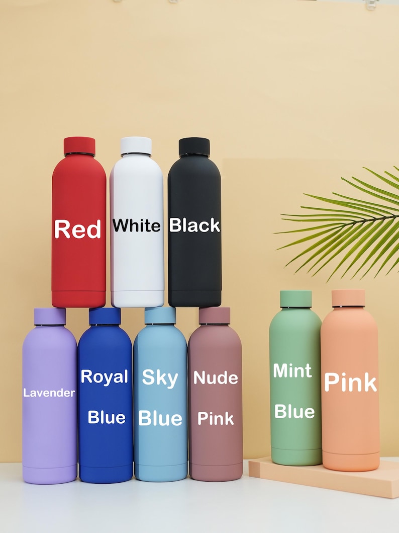 May include: Nine different colored reusable water bottles with labels indicating their color. The colors are red, white, black, lavender, royal blue, sky blue, nude pink, mint green, and pink.