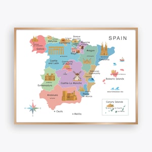 May include: A framed map of Spain, featuring colorful regions with illustrations of landmarks. The map includes the Canary and Balearic Islands, with the Mediterranean Sea labeled. A compass rose is in the lower left corner.