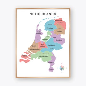 May include: A framed map of the Netherlands, showcasing the country's provinces in various colors. The map includes the names of each province, such as Groningen, Friesland, and Utrecht, with a compass rose in the lower right corner.