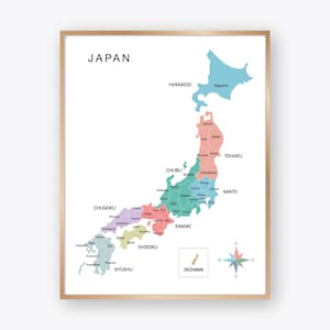 May include: A framed map of Japan, with regions highlighted in different colours. The map includes labels for major regions such as Hokkaido, Tohoku, and Kyushu. A compass rose is in the lower right corner. The word "JAPAN" is at the top.