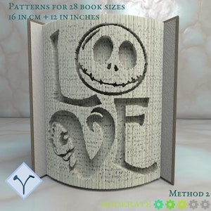 May include: A book sculpture with the word "LOVE" and a Jack Skellington face carved into the pages. The book is open, displaying the design. Text on the book reads "PATTERNS FOR 28 BOOK SIZES 16 IN CM + 12 IN INCHES" and "METHOD 2".