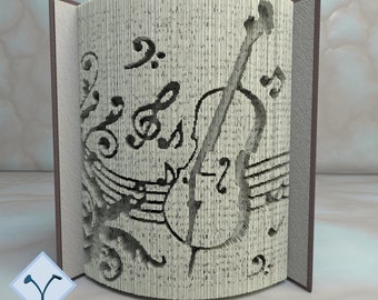 May include: A book art project with a complex design of a violin and musical notes. The book is folded to create a 3D sculpture. The title "PATTERNS FOR 28 BOOK SIZES 16 IN CM + 12 IN INCHES" is at the top of the image. The text "METHOD 2 COMPLEX" is at the bottom of the image.