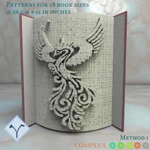 May include: A book with pages folded to create a phoenix design. The book is open, revealing the intricate bird silhouette. Text on the image reads "PATTERNS FOR 28 BOOK SIZES 16 IN CM + 12 IN INCHES" and "METHOD I COMPLEX".