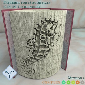 May include: A book with a seahorse design folded into a 3D sculpture. The book is 16 inches in length and 12 inches in width. The title of the book is "PATTERNS FOR 28 BOOK SIZES 16 IN CM + 12 IN INCHES". The book is labeled "METHOD 2 COMPLEX".