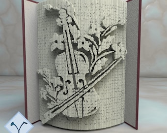以下が含まれることがあります： バイオリンと花が3Dポップアップデザインされた本。本は閉じられており、ポップアップは表示されています。表紙には「PATTERNS FOR 28 BOOK SIZES 16 IN CM + 12 IN INCHES」というテキストが印刷されています。画像の右下隅には「METHOD I COMPLEX」というテキストが印刷されています。