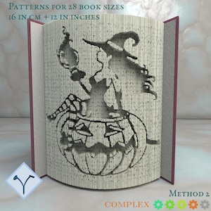 May include: A carved book with a Halloween theme. The book's pages are cut to reveal a witch on a pumpkin holding a lantern. Text on the book reads "PATTERNS FOR 28 BOOK SIZES 16 CM + 12 IN INCHES" and "METHOD 2".