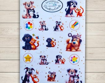 Pode incluir: Uma folha de adesivos com cães e gatos de desenho animado. Os adesivos mostram cães e gatos juntos, junto com estrelas, arco-íris e flores. O texto "DESIGNED BY Silva Rose Cards" é impresso na folha.