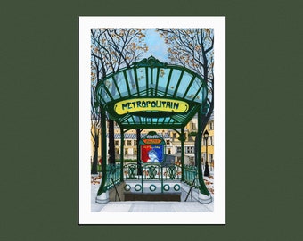 May include: A green and yellow sign with the text "METROPOLITAIN" above a subway entrance in Paris, France. The entrance is decorated with wrought iron and glass. The sign is surrounded by trees with fall foliage.