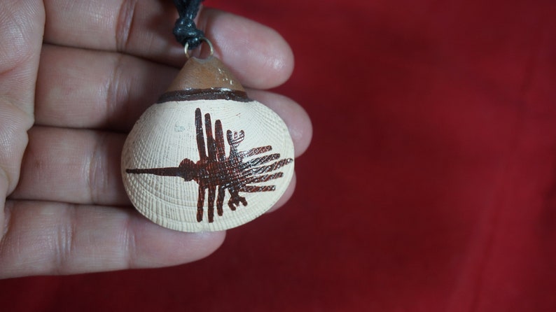 marina concha with design Line Nazca Condor Peruvian necklace