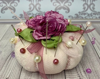 Pincushion in vintage stile with violet roses