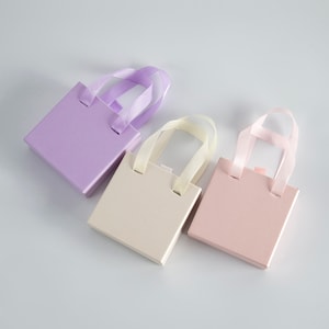 24 piezas Nuevo estilo Caja de papel Cajón de joyería Caja de cartón Tote de cinta con esponja Collar Pendientes Anillo Caja de embalaje de joyería Venta a granel