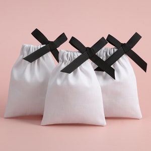 50pcs sac en toile de coton blanc avec ruban pochette d'emballage de bijoux petit sac cadeau de Noël sacs de faveur de mariage collier sacs boucles d'oreilles