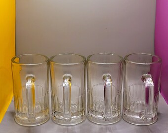 Four glass beer mugs
