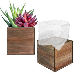 May include: Two wooden square planter boxes, one with a succulent plant and the other with a clear plastic dome. The planter boxes are brown and have a rustic look.