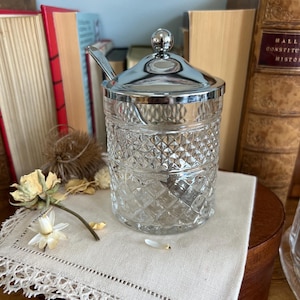 May include: A rustic wooden sign with the text "Welcome to our home" in white lettering. The sign has a distressed finish and a simple, inviting design, suitable for a front porch or entryway.