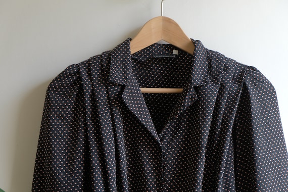 navy and white spotted blouse