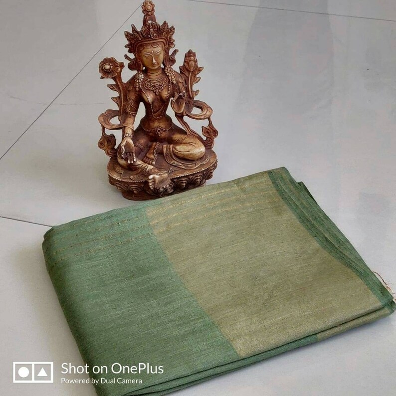 Deep Greenish Black Color Munga Tussar Saree With Contrast Matching Border and Stripe Blouse