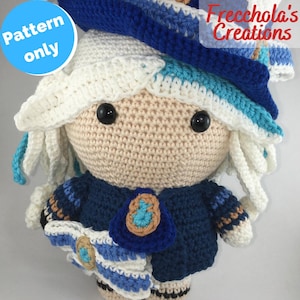 May include: A crocheted doll with a light skin tone, black eyes, and white hair. The doll wears a blue outfit with white and tan accents, and a matching hat. The text "Pattern only" is in a blue circle. The text "Freechola's Creations" is in the upper right corner.