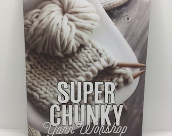 May include: A book titled "Super Chunky Yarn Workshop: Get to Grips with Bulky Wools" with a close-up of a white ball of yarn and knitting needles.