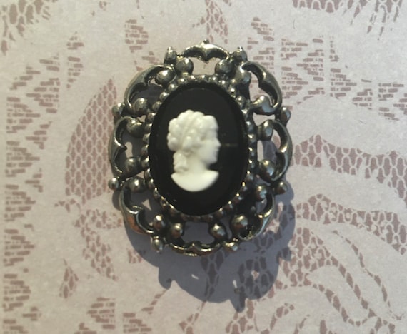 Plastic cameo shop brooch