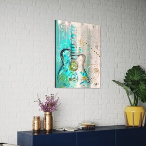 May include: Abstract painting of a teal blue acoustic guitar with white and gold accents on a light blue and beige background.